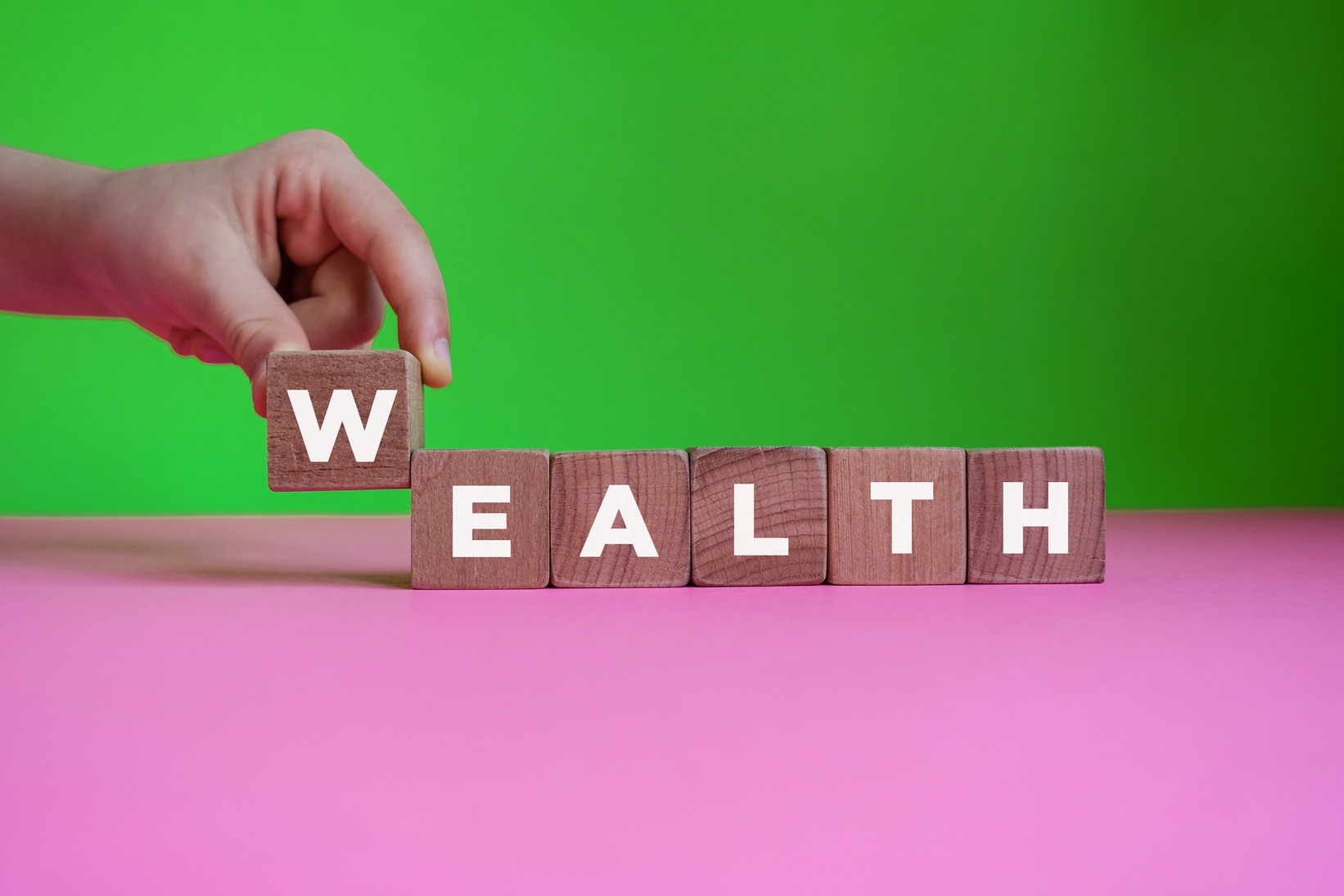 WEALTH word made with building blocks.