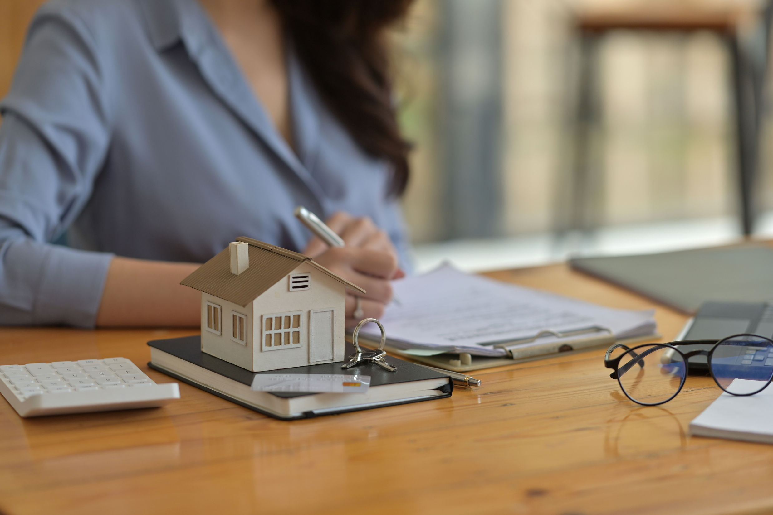 Woman Signing a Lease Agreement